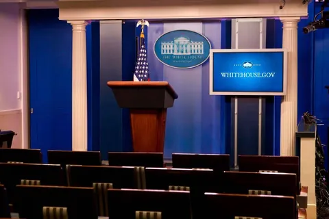 Press briefing room with lectern and backdrop