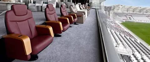 Box seats fixed on a stadium stand